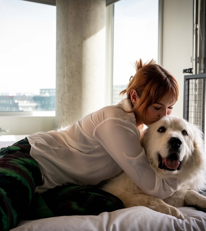 guest in room with dog at the source hotel