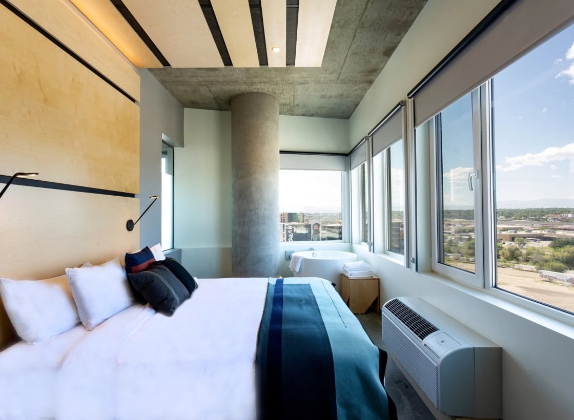 TheSourceHotel_Accommodations_SuiteSkyline_Bedroom