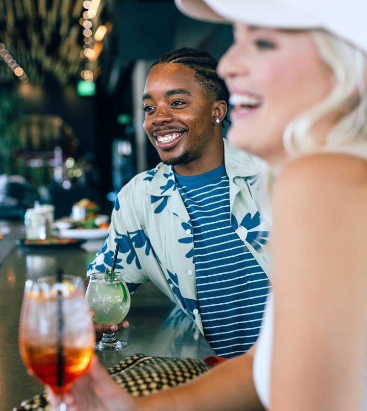 two people enjoying cocktails