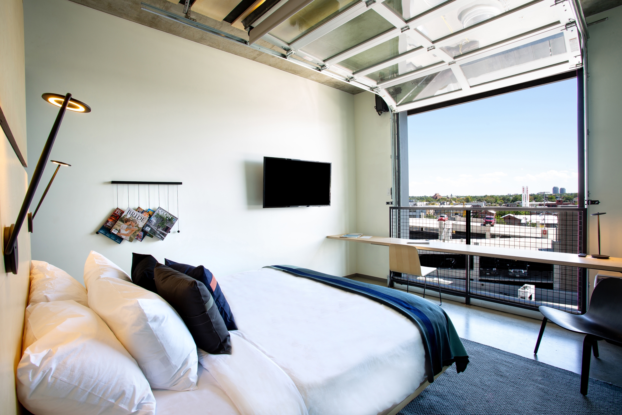 hotel bedroom with a view of the city