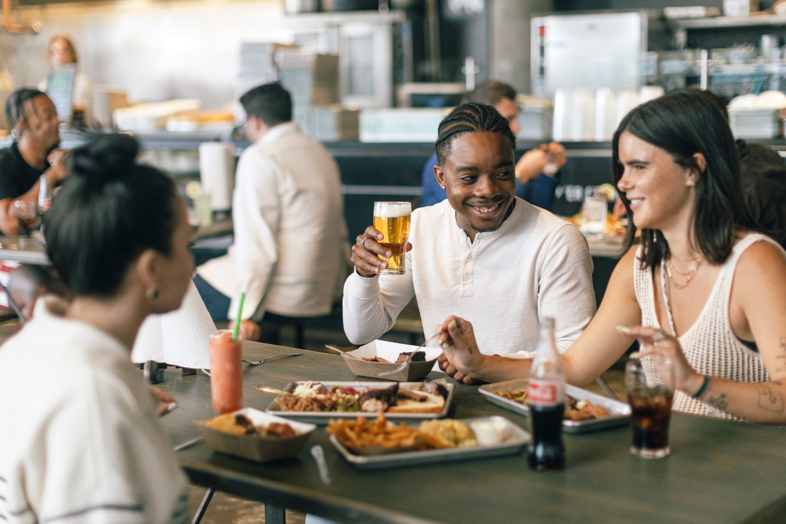 guests eating at the source