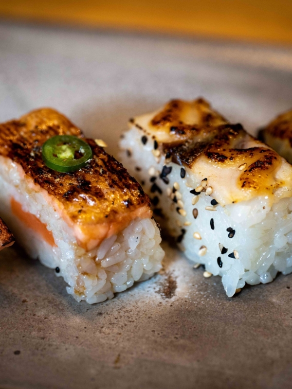 a close-up of sushi on a plate