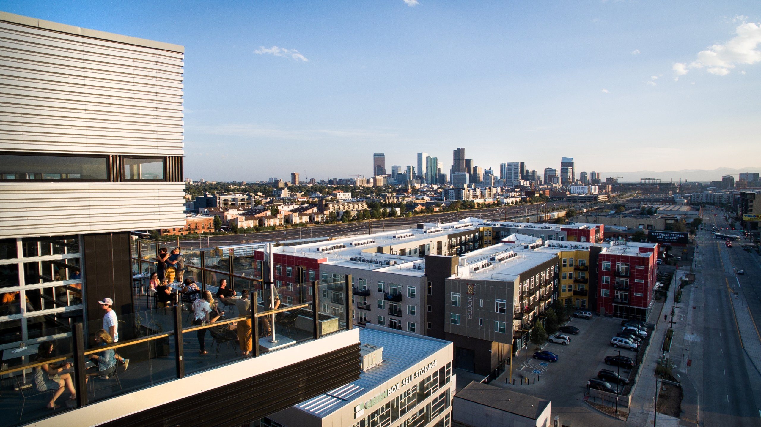drone photo of hotel in denver colorado showing hotel exterior and restaurant with a rooftop bar