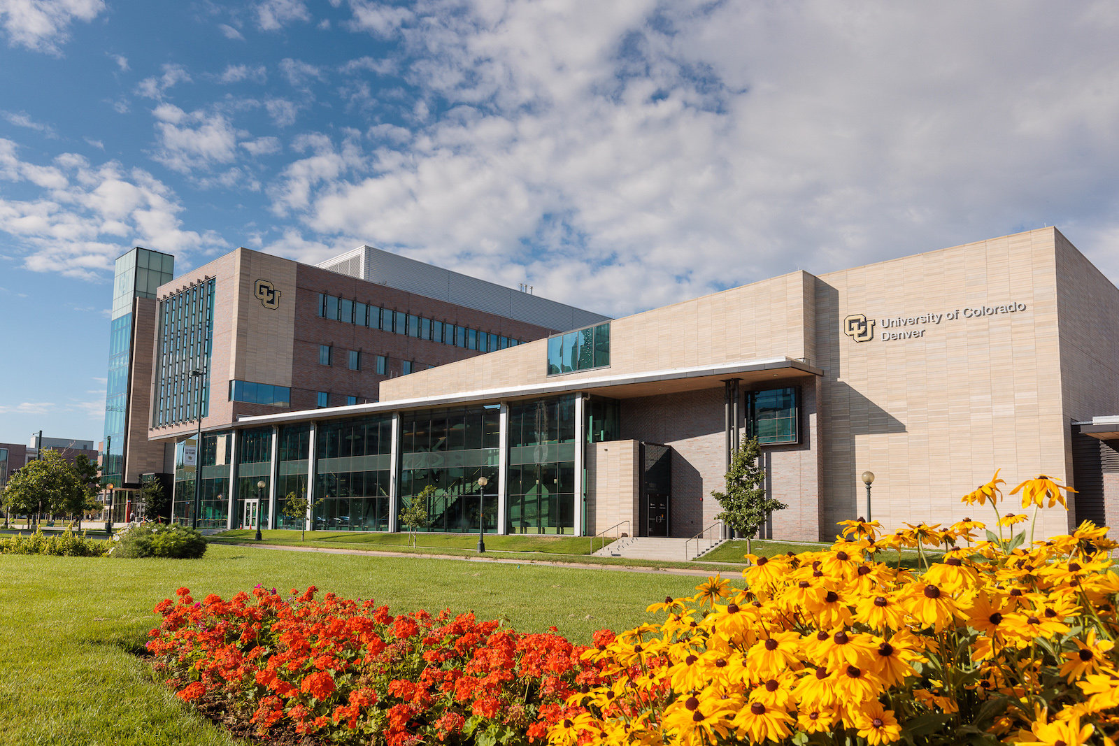 photo of university of colorado denver building with flowers in front