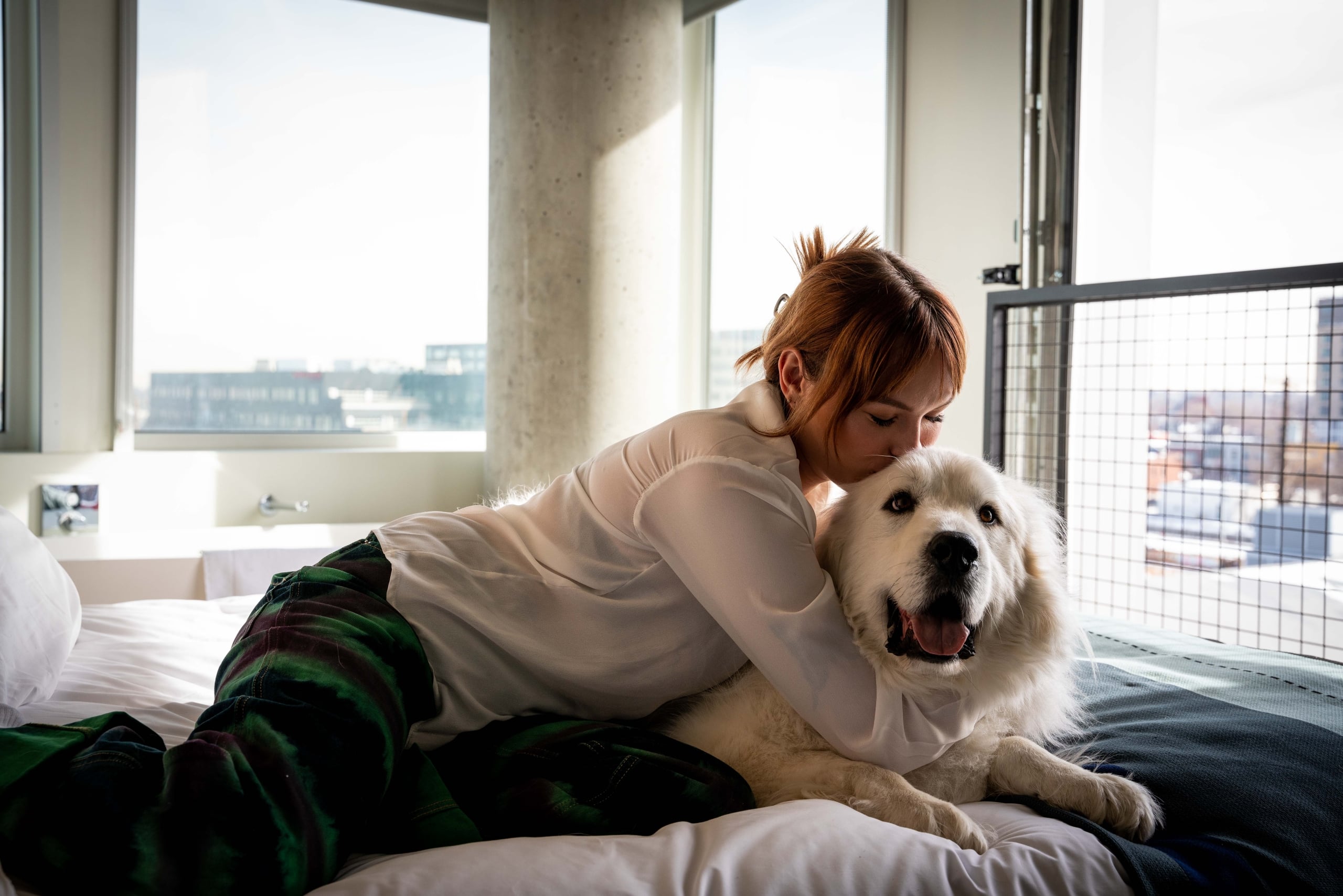 a woman embracing her dog